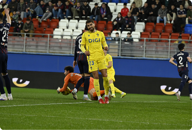 Soccer players on a field, one player is lying on the ground. Contenido generado con IA