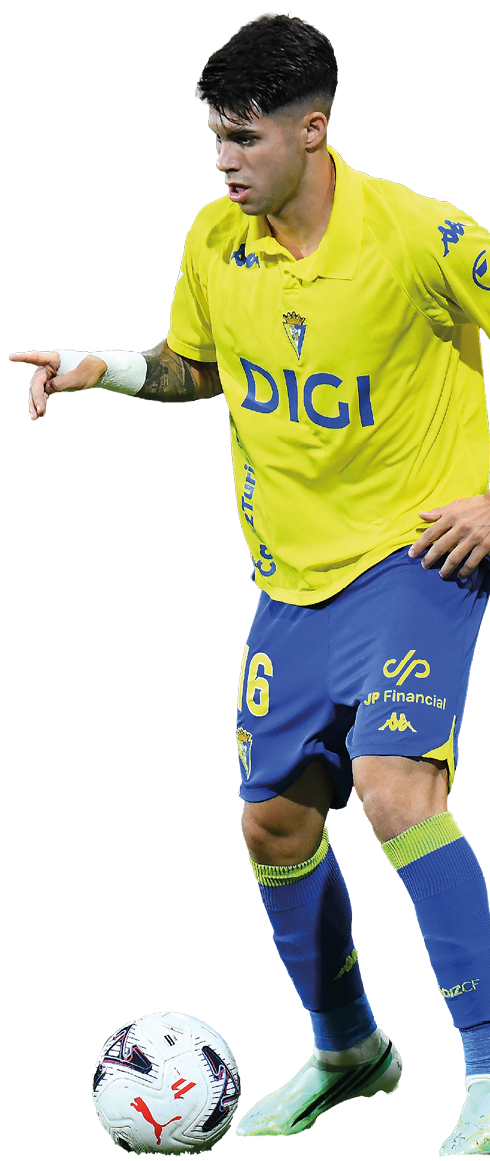 Person wearing a yellow and blue soccer uniform is controlling a soccer ball on the field. Descripci n generada con IA