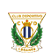 A triangular sports club emblem featuring a gold crown above vertical blue and white stripes, green laurel branches on each side, and the text “CLUB DEPORTIVO" at the top. Descripci n generada con IA