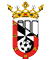 A heraldic shield divided diagonally with black and white checkered pattern and red sections featuring small yellow castles, topped with a gold crown decorated with jewels and floral elements. Descripci n generada con IA
