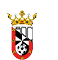 A heraldic shield divided diagonally with black and white sections, featuring red borders with gold castle icons, topped by a gold crown adorned with jewels and floral designs. Descripci n generada con IA
